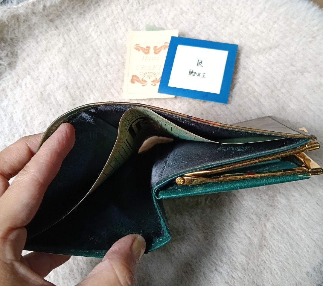 PRINCE Genuine Leather Embossed Floral Wallet (Category: Wallets & Card holders) located in Antipolo. Submitted by vastgem_4c8da8 (Listing ID 1463788227, Image 2). Description: - Vintage PRINCE wallet - Genuine leather with embossed floral design - Secure clasp closure - Multiple interior compartments - Deep green interior lining - Comes with original tags - Unique collectible piece.