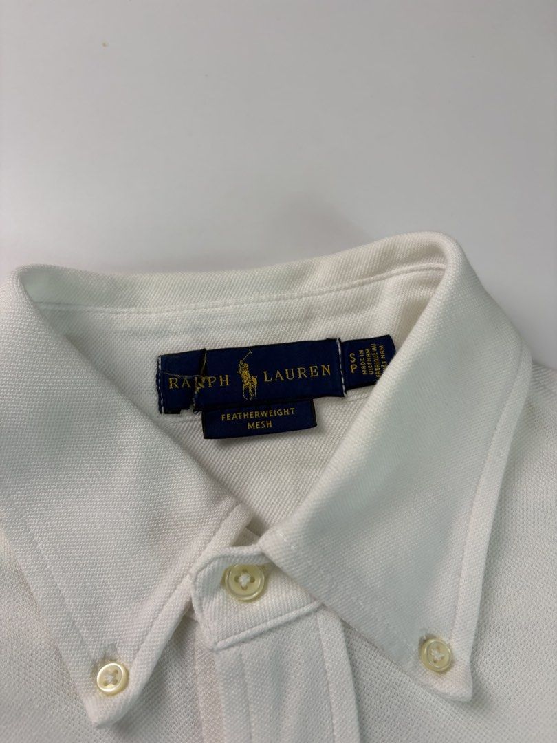 PRL White buttons down polo gold featherweight mesh (Category: Tshirts & Polo Shirts ) located in Tayabas. Submitted by thedecentoutfits (Listing ID 1463894294, Image 2). Description: PRL White buttons down polo gold featherweight mesh Size S/M, 20x27-28 Color rate - 9.8/10 As new condition.