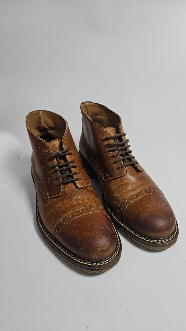 Profession Bottier Leather Cap Toe Boots (Category: Boots) located in Alfonso. Submitted by jbcamet (Listing ID 1463830863, Image 2). Description: - Brand: Profession Bottier - Material: Brown Leather - Style: Cap toe with brogue detailing - Closure: Lace-up - Condition: Soles show wear - Features: Classic look, suitable for everyday wear - Size 8 US.