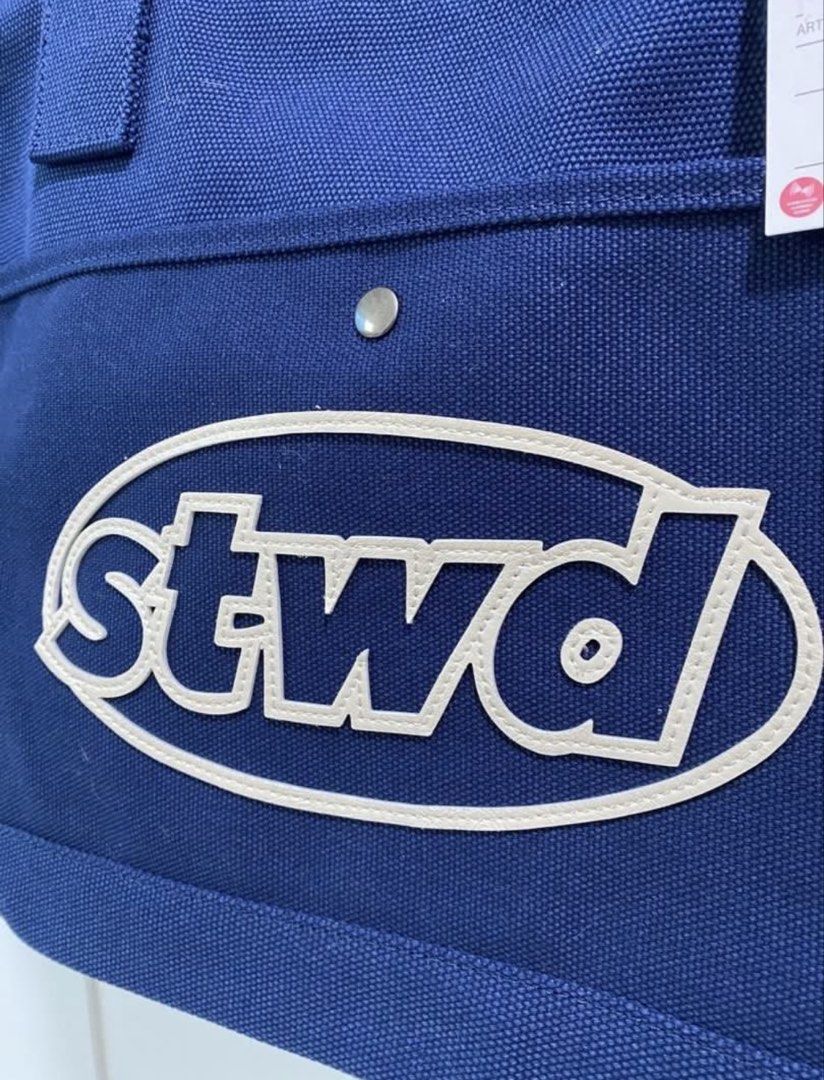 PULL & BEAR Blue STWD Large Zipped Bag (Category: Belt bags, Clutches and Pouches) located in Quezon City. Submitted by wearhouze (Listing ID 1463798089, Image 2). Description: -19x13 - Navy blue color - Features a large ‘stwd’ logo - Front pocket - Zipper closure - Two handles - Simple, clean design - Original price tag attached: €29.99.
