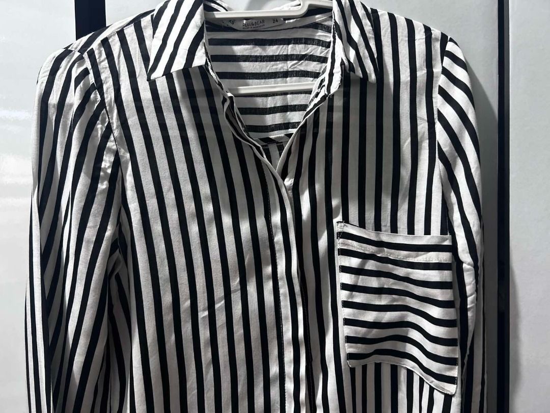 Pull & Bear Striped Long-Sleeve Shirt (Category: Longsleeves) located in Pasig City. Submitted by ladyleslieisletavelarde4902 (Listing ID 1463937427, Image 2). Description: Pair it tucked into high-waisted denim or wear it open over a basic tank top! Brand: Pull & Bear Style: Vertical black & white stripes. Single front chest pocket, lapel collar, and button-up sleeve cuffs Size: XS to S Excellent preloved condition MOP: Gcash / Bank Transfer Pur