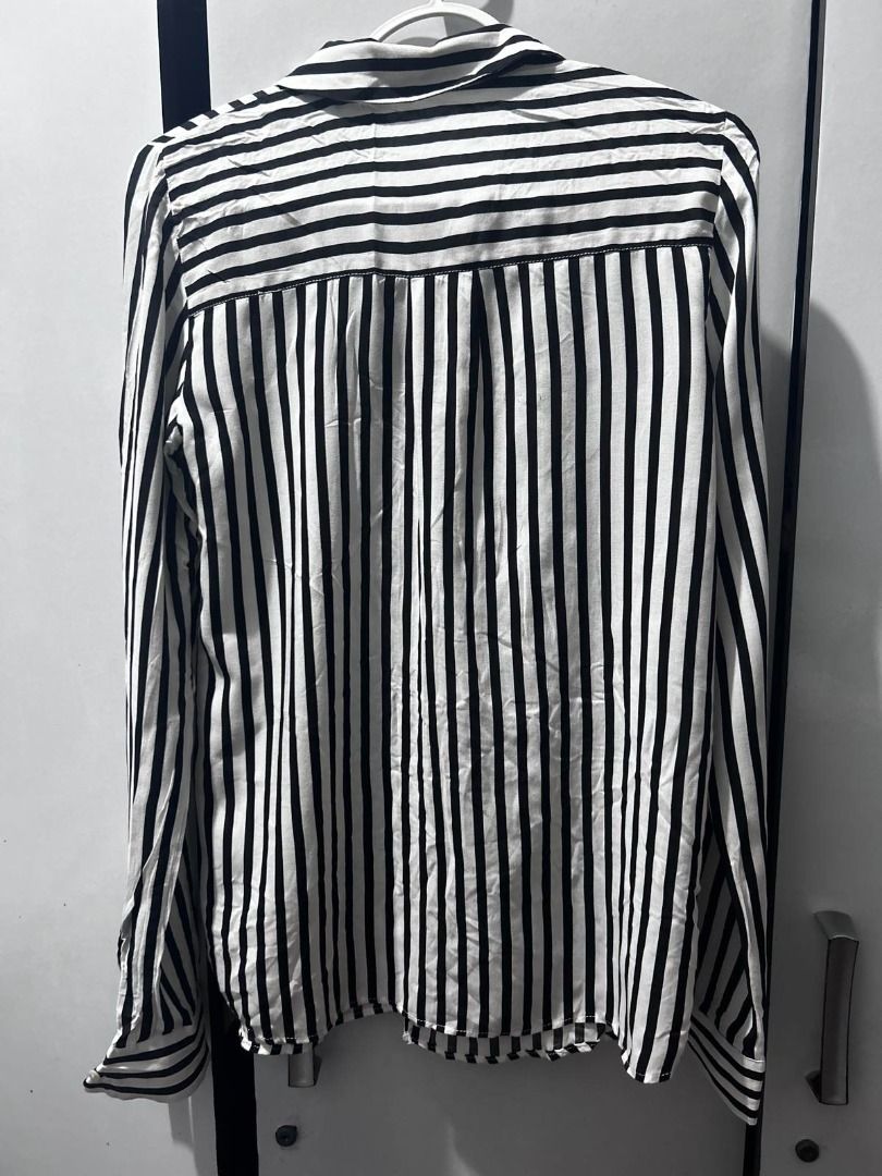 Pull & Bear Striped Long-Sleeve Shirt (Category: Longsleeves) located in Pasig City. Submitted by ladyleslieisletavelarde4902 (Listing ID 1463937427, Image 3). Description: Pair it tucked into high-waisted denim or wear it open over a basic tank top! Brand: Pull & Bear Style: Vertical black & white stripes. Single front chest pocket, lapel collar, and button-up sleeve cuffs Size: XS to S Excellent preloved condition MOP: Gcash / Bank Transfer Pur