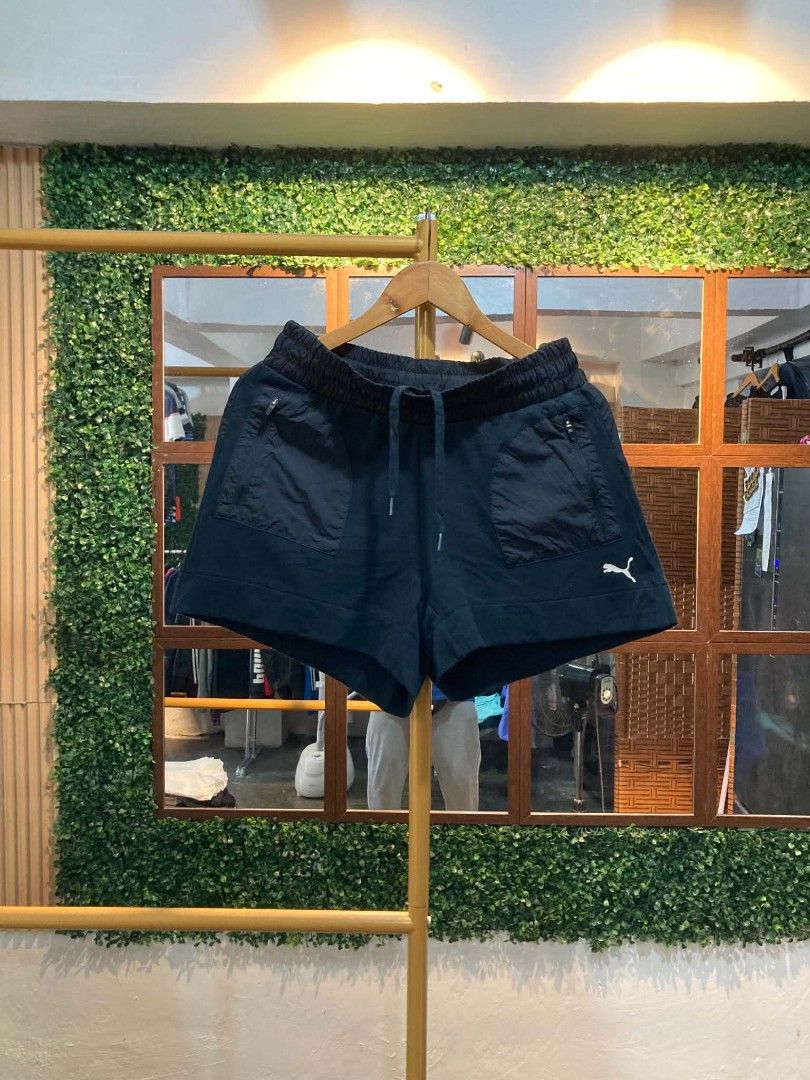 Puma Black Athletic Shorts (Category: Shorts) located in Trece Martires City. Submitted by djaothriftshop (Listing ID 1463840061, Image 1). Description: - Black Puma shorts - Elastic waistband with drawstring - Two front pockets with zippers - Small Puma logo on the left leg - Ideal for workouts or casual wear - Comfortable and practical.