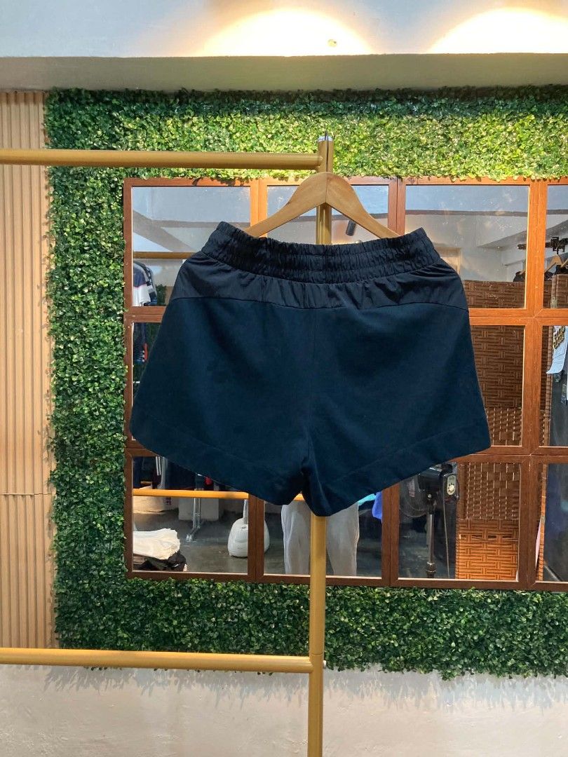 Puma Black Athletic Shorts (Category: Shorts) located in Trece Martires City. Submitted by djaothriftshop (Listing ID 1463840061, Image 2). Description: - Black Puma shorts - Elastic waistband with drawstring - Two front pockets with zippers - Small Puma logo on the left leg - Ideal for workouts or casual wear - Comfortable and practical.