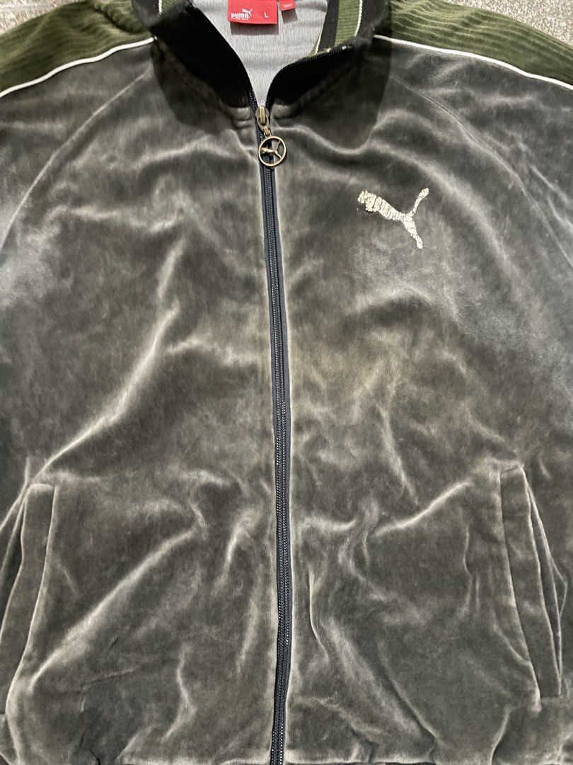 Puma Velour Track Jacket Green Size L (Category: Coats, Jackets and Outerwear) located in Manila. Submitted by yhn67 (Listing ID 1463867777, Image 3). Description: - Puma velour track jacket - Color: Dark grey/green - Embroidered classic Puma logo on chest - Ribbed collar and cuffs - Two front pockets with zip closure - Zipper pull features a Puma charm - Ideal for casual wear.
