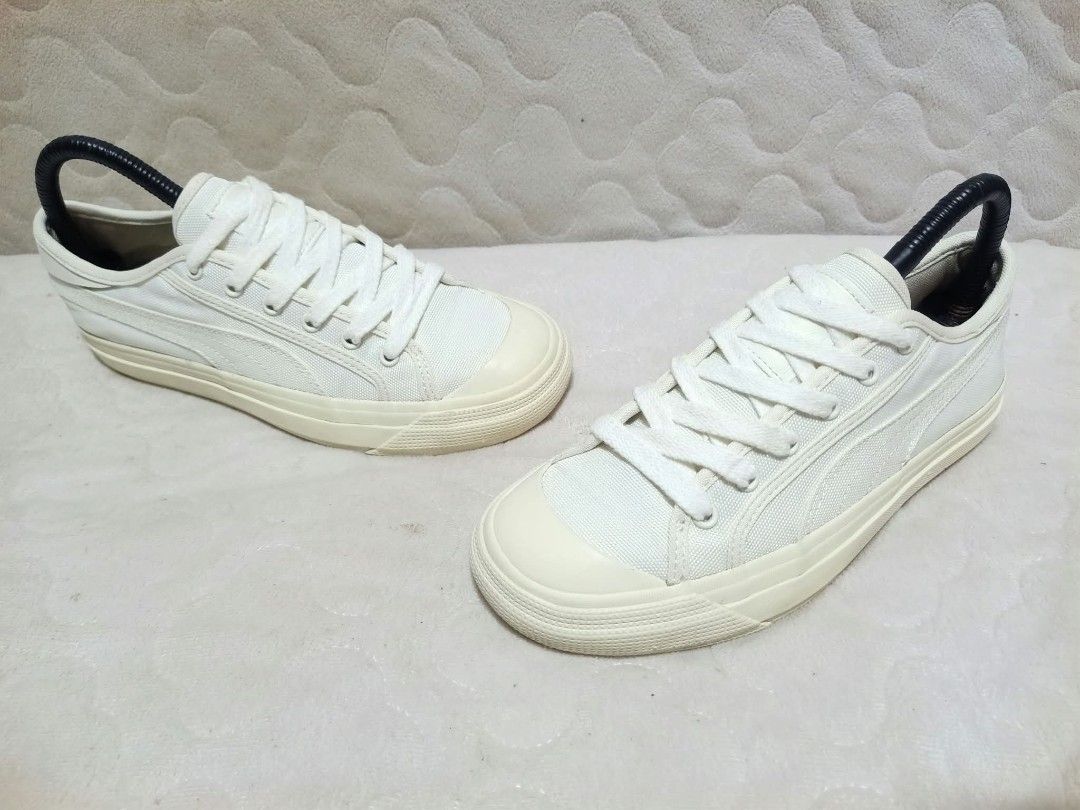 Puma White Canvas Low Top Sneakers (Category: Sneakers) located in Manila. Submitted by urbantreasures.101 (Listing ID 1463787857, Image 3). Description: - Classic white Puma sneakers - Canvas material - Low top design - Lace-up closure - Cream-colored sole and toe cap - Versatile for everyday casual outfits.