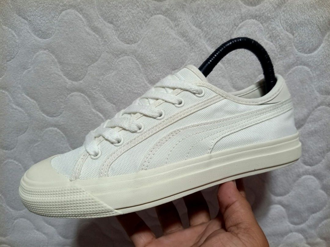 Puma White Canvas Low Top Sneakers (Category: Sneakers) located in Manila. Submitted by urbantreasures.101 (Listing ID 1463787857, Image 1). Description: - Classic white Puma sneakers - Canvas material - Low top design - Lace-up closure - Cream-colored sole and toe cap - Versatile for everyday casual outfits.
