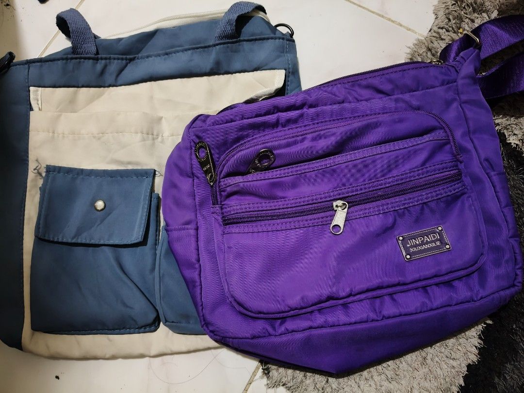Purple Crossbody Bag (Category: Cross-body Bags) located in Marikina City. Submitted by cloudycookie22 (Listing ID 1463935061, Image 2). Description: Purple crossbody bag. Nylon material. Multiple front zip pockets, adjustable strap. Spacious interior, perfect for daily use. The other is a freebie. .