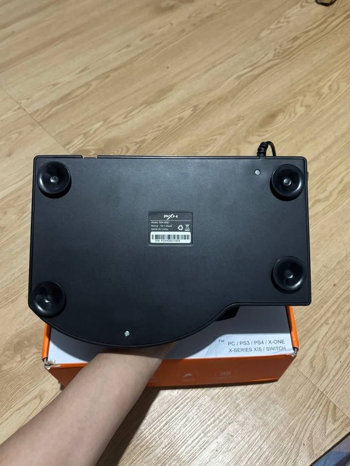 PXN 0082 Joystick/Arcade Stick for PS4, Xbox, Switch, PC (Category: Controllers) located in Rizal. Submitted by jjszenn (Listing ID 1463788644, Image 2). Description: PXN 0082 USB Arcade Stick for PS4, Xbox, Switch, PC - Makinis na makinis pa - Plug and Play - All buttons are working - Barely even played once. Only tried the buttons on Tekken 8 if it is working. - As good as new. - With Box, complete manual. - Compatible with PS4, Xbox, Switch, P