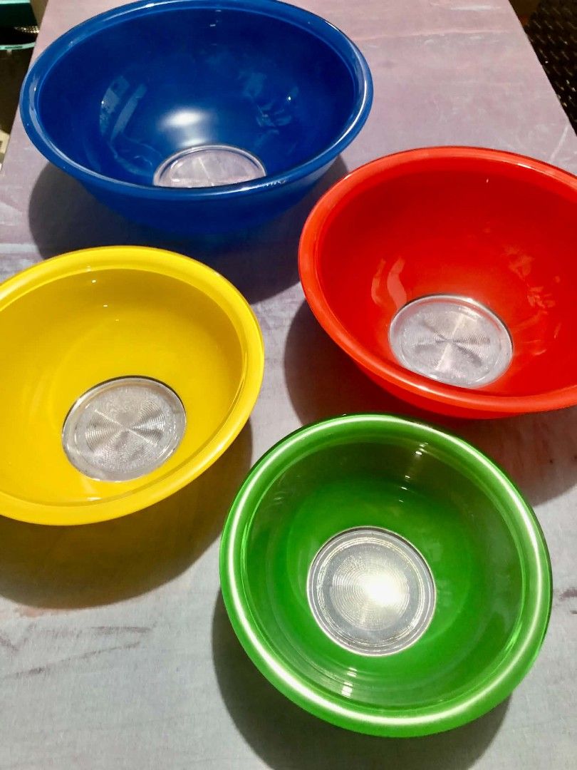 Pyrex Bowls Set (Category: Dinnerware & Cutlery) located in Quezon City. Submitted by zoey_vintage_shop (Listing ID 1463875631, Image 2). Description: P3500 - 4 Piece Set Vintage Pyrex Rainbow nesting mixing bowls with clear glass bottoms, featuring 4 colorful bowls in blue, red, yellow, and green. Condition: Pre-owned vintage condition with normal sign of age and use. Please review all photos closes as they are part of the description. No chips 