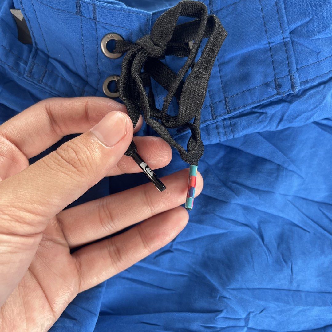 Quiksilver Blue Boardshorts Size 34 (Category: Swim Trunks & Board Shorts) located in General Mariano Alvarez. Submitted by aaronatas819577 (Listing ID 1463770348, Image 3). Description: - Brand: Quiksilver - Color: Blue - Size: 34 - Features: Cargo pocket on left leg, drawstring waist with lace tie - Ideal for: Swimming, surfing, beach trips.