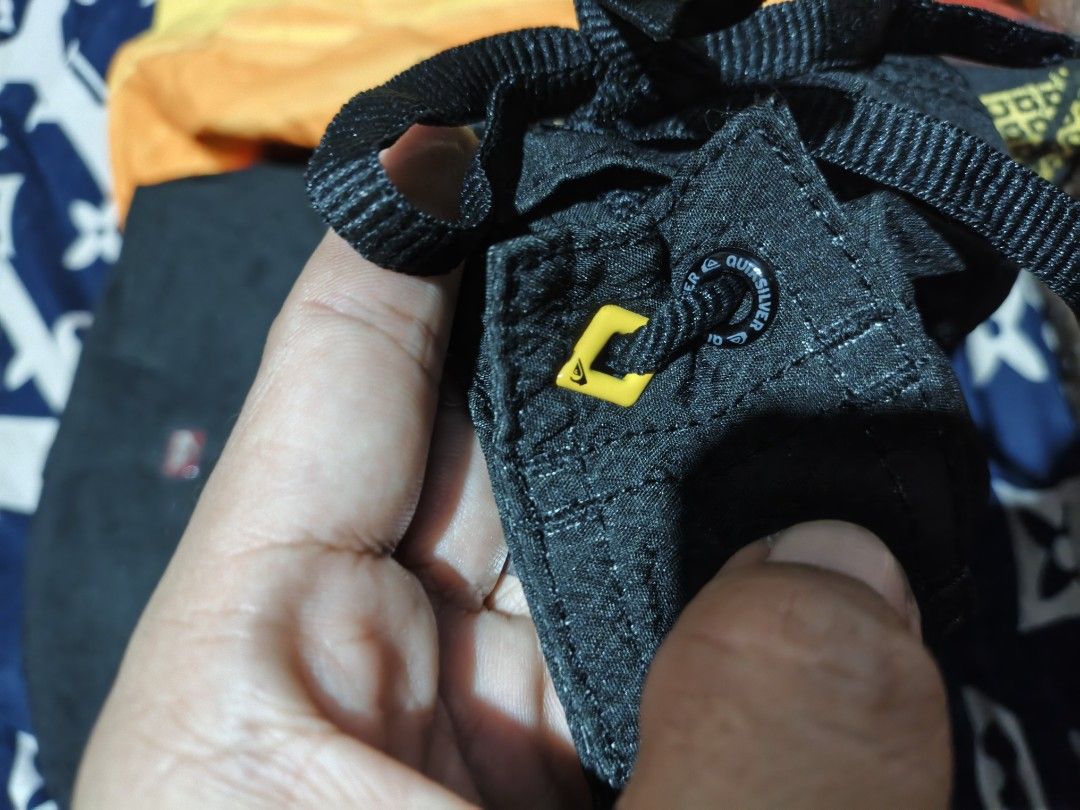 Quiksilver Board Shorts Size S (Category: Swim Trunks & Board Shorts) located in Maasim. Submitted by ukayganda25 (Listing ID 1463890862, Image 3). Description: - Quiksilver Board Shorts - Size: L - Color: Bright Yellow with Black & Orange Sunset Graphic - Material: 100% Polyester - Ideal for: Swimming, Surfing - Features: Drawstring Waist for Secure Fit, Quiksilver Logo.