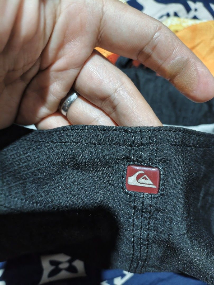 Quiksilver Board Shorts Size S (Category: Swim Trunks & Board Shorts) located in Maasim. Submitted by ukayganda25 (Listing ID 1463890862, Image 2). Description: - Quiksilver Board Shorts - Size: L - Color: Bright Yellow with Black & Orange Sunset Graphic - Material: 100% Polyester - Ideal for: Swimming, Surfing - Features: Drawstring Waist for Secure Fit, Quiksilver Logo.
