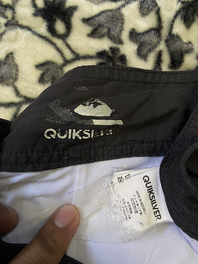 Quiksilver Striped Board Shorts (Category: Swim Trunks & Board Shorts) located in Sebaste. Submitted by phak.thrifts (Listing ID 1463850023, Image 3). Description: - Brand: Quiksilver - Design: Black and white stripes - Features: Drawstring waist, back pocket - Branding: Quiksilver logo on left leg and back pocket - Origin: Made in Indonesia - Ideal for: Swimming, surfing, beach activities.