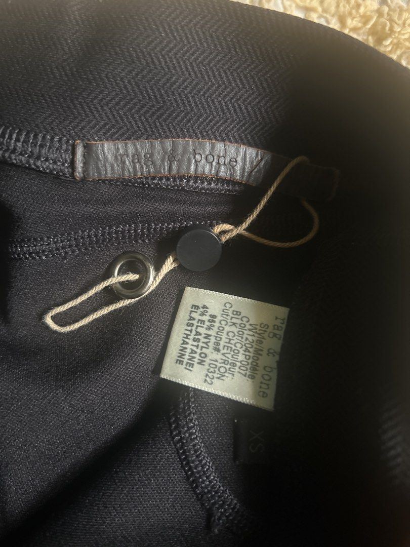 Rag & Bone Black Chevron Pants XS (Category: Jeans) located in Lal-Lo. Submitted by pureearth_8c747c (Listing ID 1463785445, Image 2). Description: - Brand: Rag & Bone - Color: Black - Style: Chevron pants - Features: Zipper detail at the ankle - Material: Nylon and Elastane blend for comfort - Size: XS - Versatile: Great for everyday wear or workouts.
