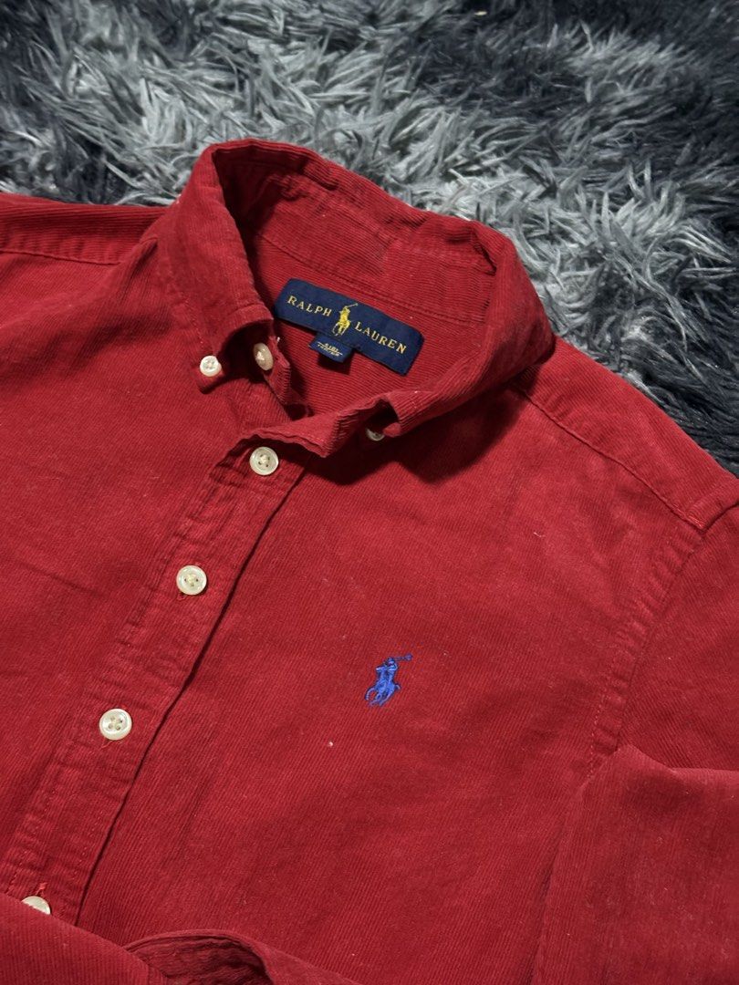 Ralph Lauren Corduroy Button Down Shirt Red (Category: Tshirts & Polo Shirts ) located in Bulacan. Submitted by luck_finds (Listing ID 1463865074, Image 3). Description: - Kids size W: 15 L: 21 - Classic red corduroy shirt from Ralph Lauren - Long sleeves with button cuffs - Iconic polo player logo embroidered on the chest - Button-down collar - Made in Indonesia - Versatile for casual or smart-casual outfits.