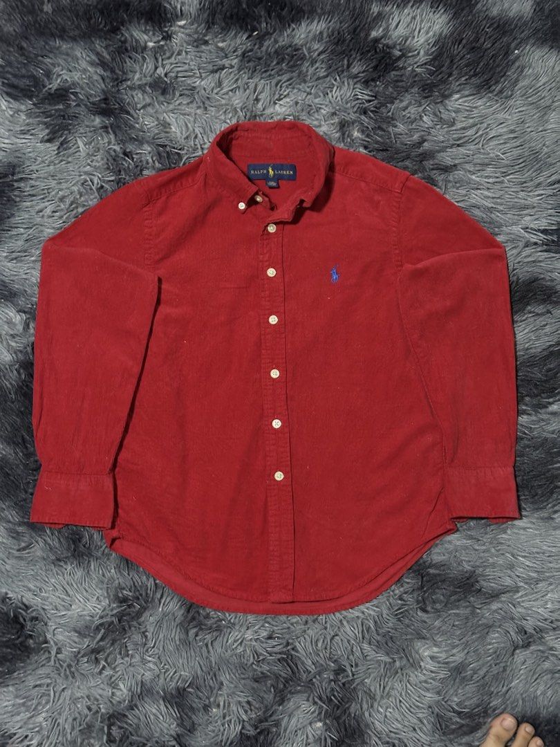 Ralph Lauren Corduroy Button Down Shirt Red (Category: Tshirts & Polo Shirts ) located in Bulacan. Submitted by luck_finds (Listing ID 1463865074, Image 1). Description: - Kids size W: 15 L: 21 - Classic red corduroy shirt from Ralph Lauren - Long sleeves with button cuffs - Iconic polo player logo embroidered on the chest - Button-down collar - Made in Indonesia - Versatile for casual or smart-casual outfits.