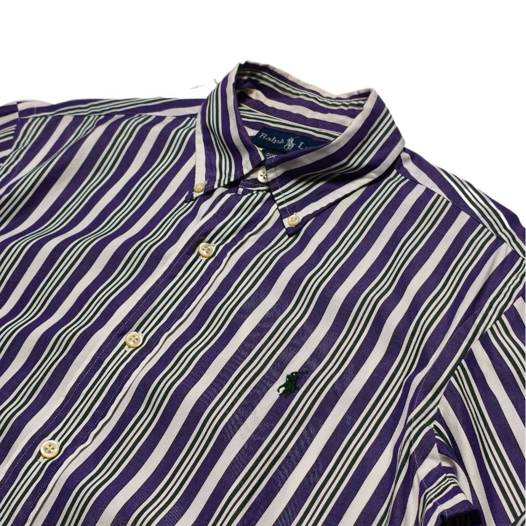 Ralph Lauren Custom Fit Striped Button-Down Shirt (Category: Tshirts & Polo Shirts ) located in Meycauayan. Submitted by thrifting_gorilla (Listing ID 1463930982, Image 3). Description: - Classic Ralph Lauren button-down shirt -Dimes: 20.5 x 30-31 - Sleeves: 26 - Features purple, green, and white vertical stripes - Signature embroidered pony logo on the chest - Button-down collar and button cuffs - Perfect for casual or smart-casual occasions - M