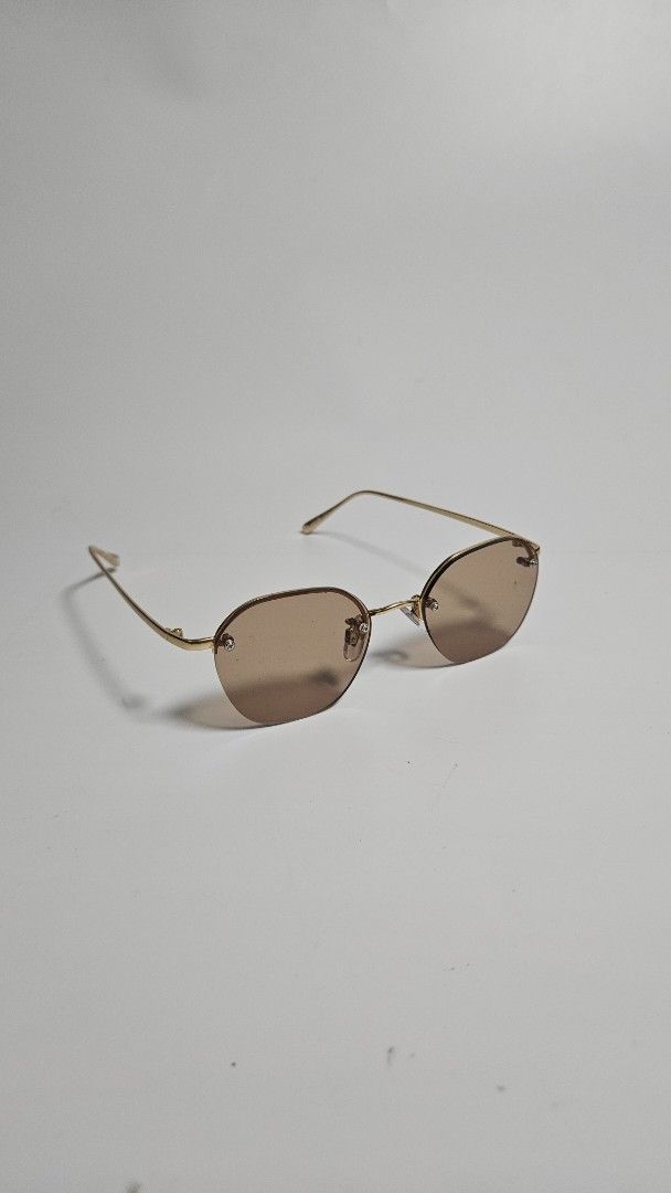 Ray BEAMS x no eyedia Rimless Sunglasses (Category: Sunglasses & Eyewear) located in Alfonso. Submitted by jbcamet (Listing ID 1463824176, Image 2). Description: - Brand: Ray BEAMS x no eyedia - Style: Rimless design - Frame: Gold-tone metal - Lenses: Brown tinted - Features: Lightweight, comfortable - Perfect for: Sunny days, completing any outfit.