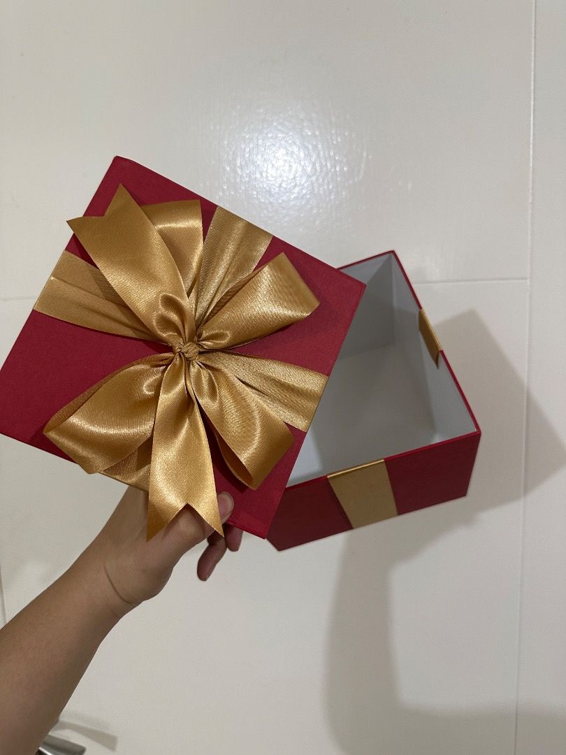 Red Gift Box with Gold or White Ribbon (Category: Storage Boxes & Baskets) located in Mandaluyong City. Submitted by lovedbyjaaaam (Listing ID 1463749353, Image 2). Description: - Set of sturdy red gift boxes - Available with gold or white ribbon options - Ideal for birthdays, holidays, and special occasions - Perfect for gift-giving or stylish storage - Boxes are empty and ready to be filled with your presents Small - 6.5x6.5x5 - 200 Medium - 8.