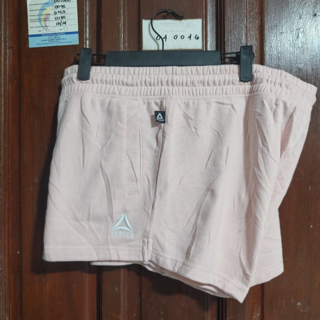 Reebok Fleece garter shorts (Category: Shorts) located in Quezon City. Submitted by makmakramirez (Listing ID 1463891775, Image 3). Description: size 32-40 length 12inches Authentic Reebok Shorts: Women's size Large (L/G/G). ​Soft & Cozy: Made from a comfortable 60% cotton, 40% polyester fleece blend. ​Pastel Pink Style: Light pink shade with a subtle Reebok logo. ​Custom Fit: Flexible elastic waistband with drawstrings. ​Practical: Features side