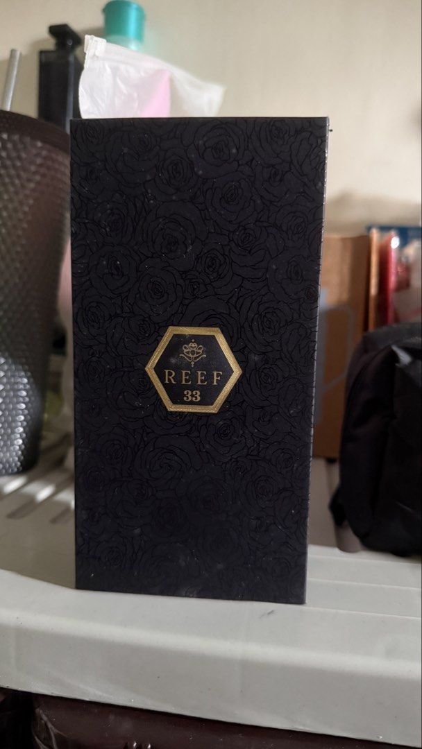 Reef 33 Perfume for Men (Category: Fragrance & Deodorants) located in Mandaluyong City. Submitted by arlorebecc47663 (Listing ID 1463794856, Image 1). Description: - Reef 33 Perfume - Sleek black bottle with gold accents - Elegant black packaging with rose pattern - Wonderful, captivating scent - Selling because of an overabundance of perfumes - Feel free to ask any questions! - Never Used and Sprayed.