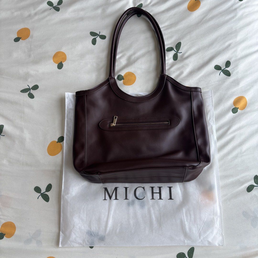 Reversible Brown Leather Tote Bag (Category: Tote Bags) located in Paranaque City. Submitted by aileecstls (Listing ID 1463783173, Image 3). Description: - Dark brown leather bag from MICHI - Reversible, almost new (once lang nagamit) - Comes with original dust bag - Price: Php 400.