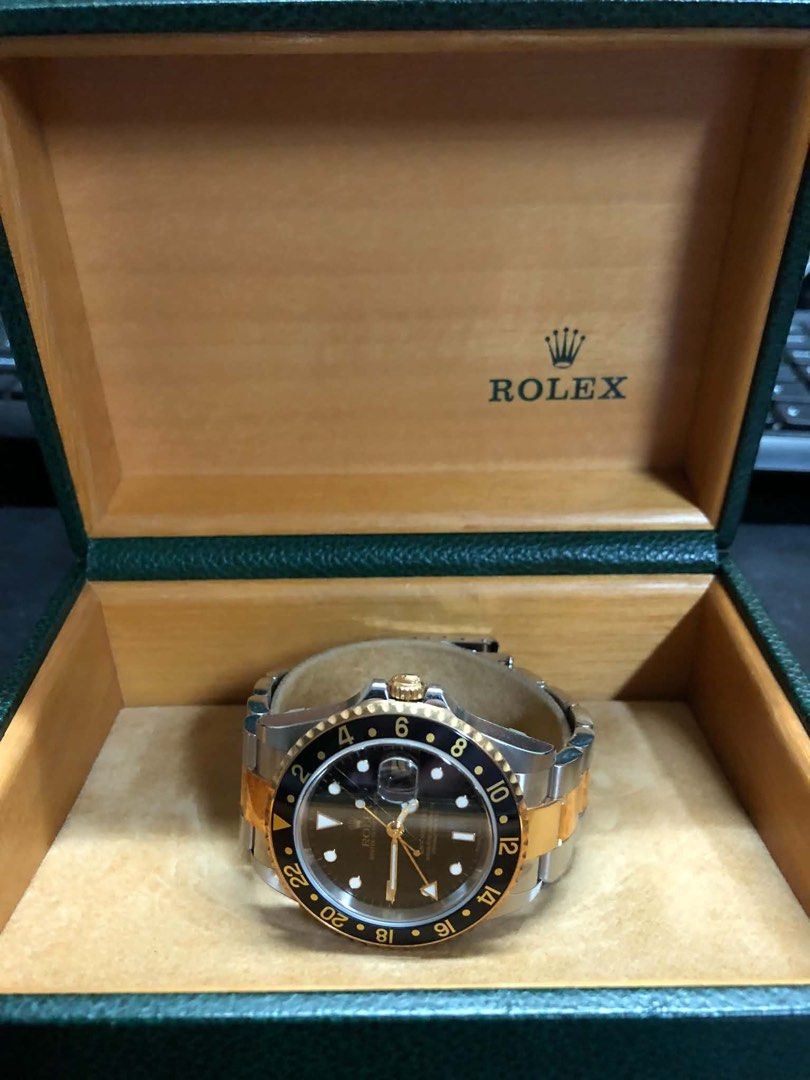 Rolex GMT-Master II Two-Tone Brown Dial Watch (Category: Luxury Watches) located in Pasig City. Submitted by nicolesbox (Listing ID 1463830948, Image 3). Description: - Rolex GMT-Master II - Two-tone stainless steel and gold construction - Elegant brown dial with date window - Comes with original box - Ideal for watch collectors - Essential feature for travelers with GMT function.
