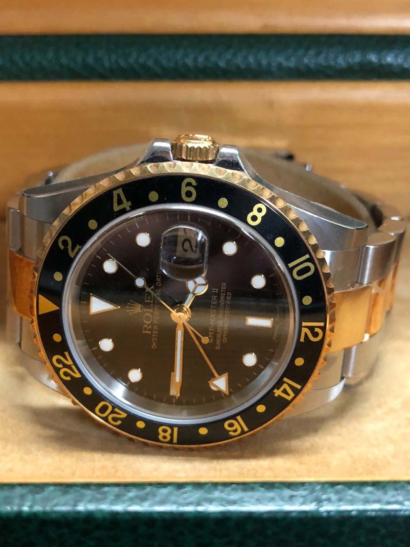 Rolex GMT-Master II Two-Tone Brown Dial Watch (Category: Luxury Watches) located in Pasig City. Submitted by nicolesbox (Listing ID 1463830948, Image 1). Description: - Rolex GMT-Master II - Two-tone stainless steel and gold construction - Elegant brown dial with date window - Comes with original box - Ideal for watch collectors - Essential feature for travelers with GMT function.