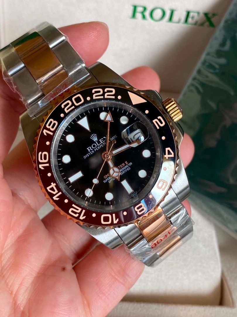 ROLEX ROOT BEER (Category: Luxury Watches) located in Caloocan City. Submitted by mrbigdreams (Listing ID 1463765676, Image 3). Description: - Rolex GMT-Master II - Two-tone steel and rose gold construction - Classic black dial with date function - Rotating bezel for tracking multiple time zones - Comfortable and durable Oyster bracelet - Ideal for travelers and everyday wear - Comes with original box.