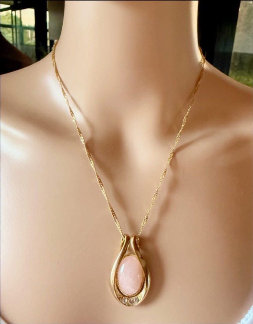Rose Quartz necklace (Category: Other Accessories) located in Manila. Submitted by annafinds (Listing ID 1463923120, Image 1). Description: This is a gold-toned necklace featuring an oval Rose Quartz stone inside a sleek teardrop loop accented with tiny clear crystals at the base. ₱3,999 Open for layaway..