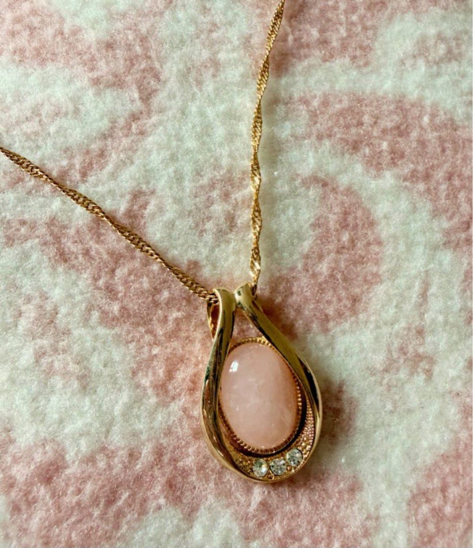 Rose Quartz necklace (Category: Other Accessories) located in Manila. Submitted by annafinds (Listing ID 1463923120, Image 2). Description: This is a gold-toned necklace featuring an oval Rose Quartz stone inside a sleek teardrop loop accented with tiny clear crystals at the base. ₱3,999 Open for layaway..