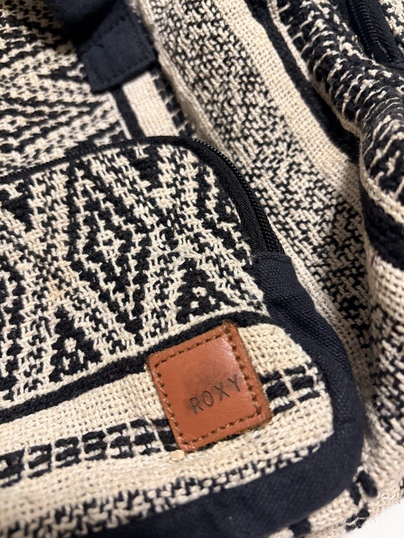 Roxy Boho Pattern Tote Bag (Category: Tote Bags) located in Mandaluyong City. Submitted by sarisaringtinda (Listing ID 1463877318, Image 2). Description: - Stylish Roxy tote bag with a black and cream boho pattern. - Two top handles and a long shoulder strap for versatile carrying. - Multiple convenient pockets on the outside. - Fully lined interior in black. - All zippers are in good working condition. - Ideal for everyday errands or your next t