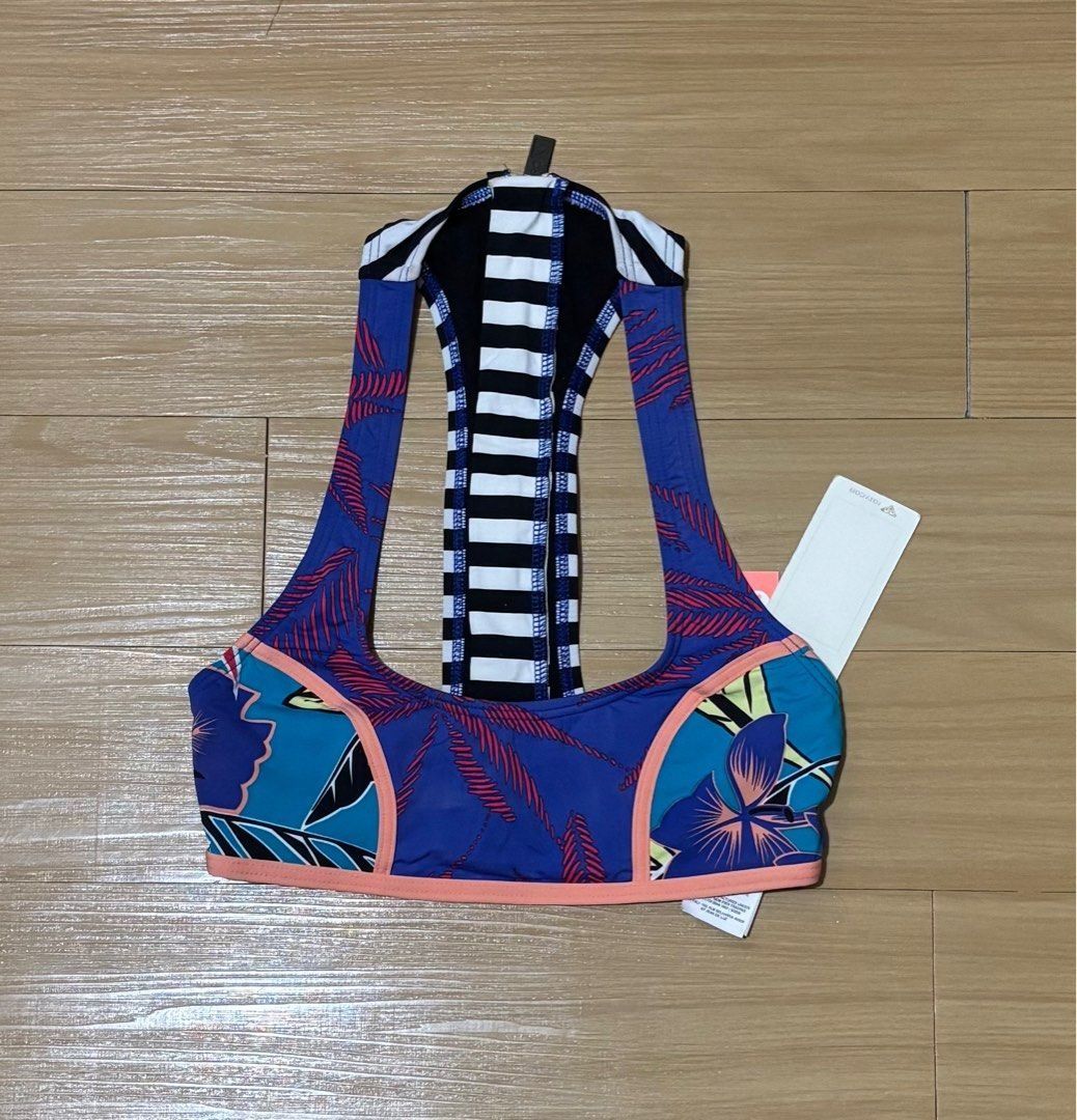 Roxy Printed/Striped Bikini Top XS (Category: Bikinis & Swimsuits) located in Quezon City. Submitted by garagesale2026 (Listing ID 1463868472, Image 1). Description: - Brand new with tag - Original from US - Ideal for kids - XS on tag, runs small, fit kids - Unique racerback design; Zipper back closure; Blue base with pink adn teal accents; Striped back detail; Coral colored detail and hem.