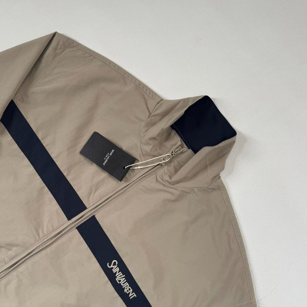Saint Laurent Cotton Jacket in Beige/Blue (Category: Coats, Jackets and Outerwear) located in Manila. Submitted by mountebanc_on_ig (Listing ID 1463852052, Image 3). Description: Saint Laurent Cotton Jacket in Beige/Blue Stand-collar jacket crafted from a structured blend with a viscose and cotton lining. Features a Cassandre front zip closure, drop shoulders, two welt pockets, a stand collar, single snap-button cuffs, and subtle embroidery at th