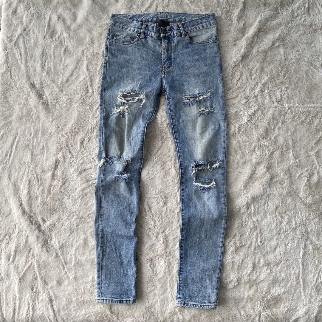 SAINT LAURENT PARIS RIPPED JEANS (Category: Luxury Apparel) located in Cadiz. Submitted by thrift_hunt_garage (Listing ID 1463883839, Image 1). Description: SAINT LAURENT PARIS RIPPED JEANS Size and measurements by inches : On tag 29 Width 30 Length 42 Rise 10 Leg opening 6 Knee 7 Thigh 9.5 Conditions and details : Ripped/Tattered factory design Wash denim Slim fit type Issue none Flaws need wash .