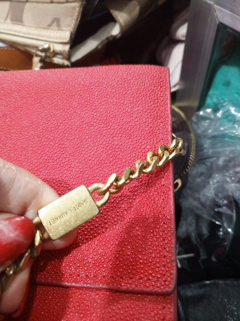 Saint Laurent Red Leather Wallet on Chain Bag (Category: Luxury Bags & Wallets) located in Bambang. Submitted by myna88 (Listing ID 1463854856, Image 2). Description: - Authentic Red Saint Laurent Wallet on Chain - Elegant gold hardware - Iconic YSL logo on the front - Interior card slots for organization - Detachable chain strap for versatile styling.