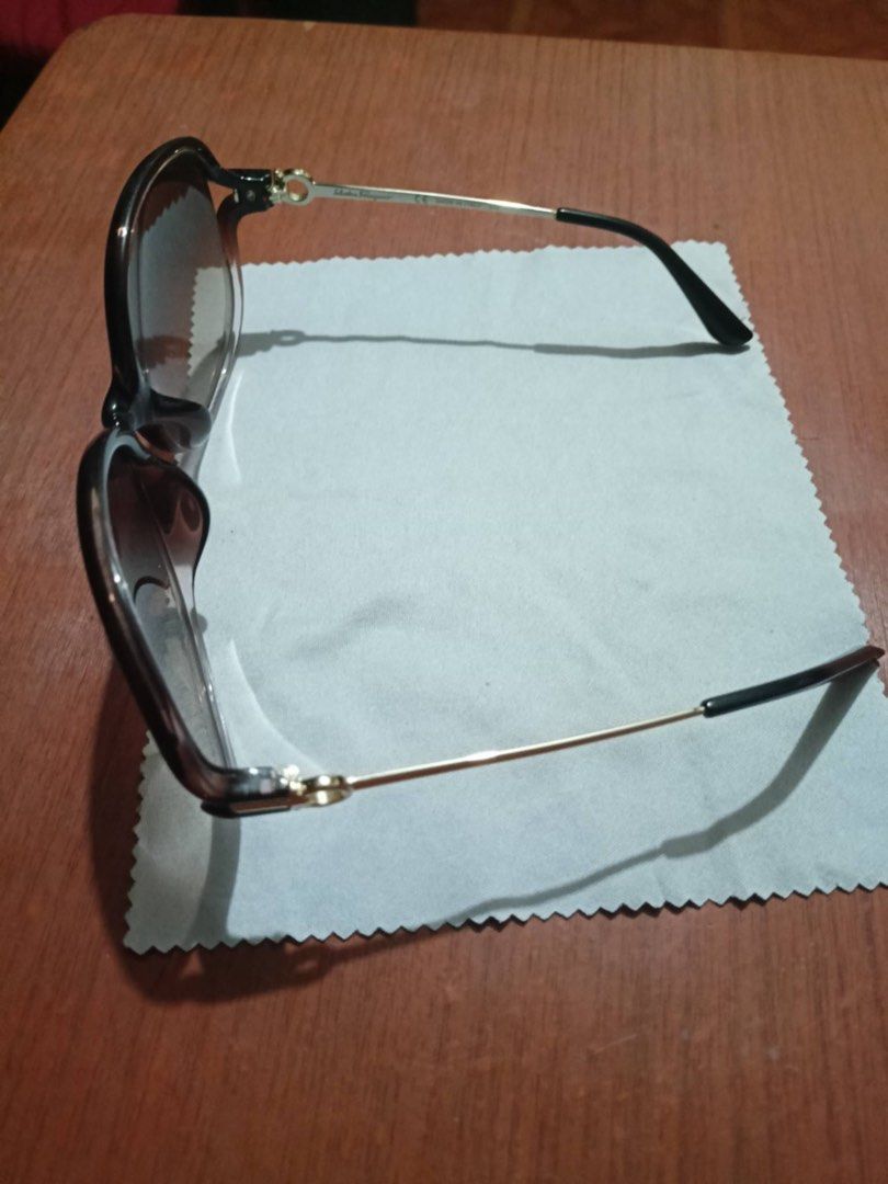 Salvatore Ferragamo Sunglasses (Category: Sunglasses & Eyewear) located in Manila. Submitted by shanaaa.collects (Listing ID 1463846439, Image 3). Description: - Authentic Salvatore Ferragamo sunglasses - Classic brown tortoiseshell oval frames - Gradient lenses for stylish sun protection - Elegant gold accents on the arms - Ideal for everyday wear - Comes with a complimentary cleaning cloth.