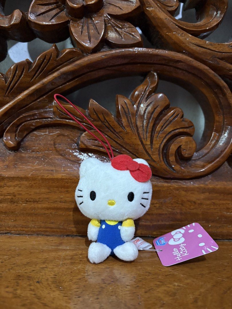 Sanrio Hello Kitty Plush Keychain Toy (Category: Plushies & Soft Toys) located in Quezon City. Submitted by rxyel (Listing ID 1463804925, Image 1). Description: - Adorable Kitty plush toy - Features a classic red bow and blue overalls - Includes a red string for easy hanging - Still has original tags attached - Small and portable size - Ideal for decorating bags, backpacks, or keys - A must-have for Kitty collectors and fans.