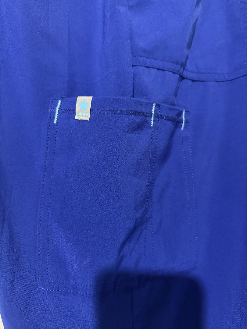 Scrubstar Royal Blue Cargo Scrub Pants (Category: Joggers) located in Tuguegarao City. Submitted by janurtist (Listing ID 1463744007, Image 3). Description: - Royal blue cargo scrub pants by Scrubstar - Elastic waistband with adjustable drawstring - Multiple pockets for ample storage - Side slits at the hem for ease of movement - Comfortable and practical for everyday wear Selling for 500 SF not included Loc: Abulug, Cagayan Can ship via J&T.