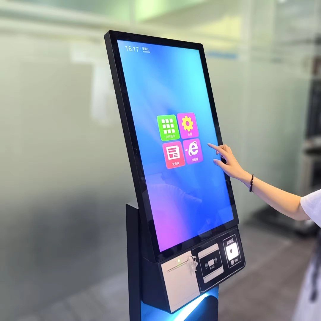 Self ordering kiosks (Category: Office & Business Technology) located in Manila. Submitted by kitsincph (Listing ID 1463800149, Image 2). Description: - Digital touchscreen kiosk perfect for self-service ordering or information display. - Built-in card reader and receipt printer for seamless transactions. - Features a stylish base with a cool blue light glow. - Multiple units available to scale your business needs. - Ideal for businesses aiming t
