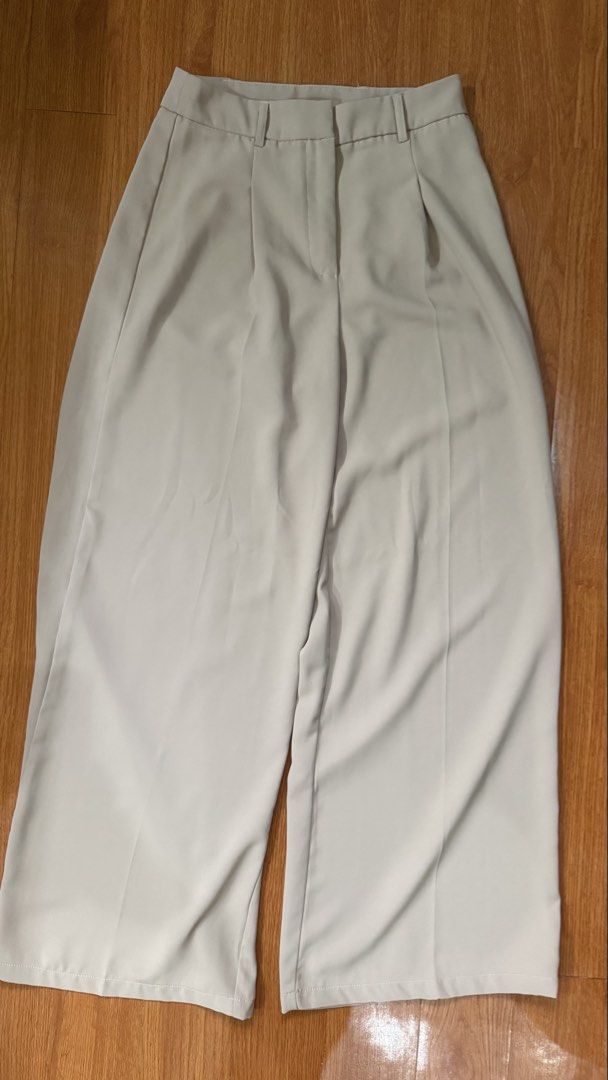 SHEIN Beige Wide Leg Culottes Pants (Category: Jeans) located in Antipolo. Submitted by japanese.siomai (Listing ID 1463796234, Image 1). Description: - SHEIN beige culottes - Wide leg style with front pleats - High-waisted fit - Size XS - Versatile for casual or work outfits - Comfortable and stylish.