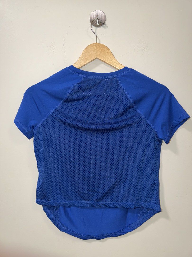 SHEIN Blue Mesh Panel Athletic T-Shirt Size S (Category: Shirts) located in Makati City. Submitted by andzr. (Listing ID 1463885019, Image 2). Description: - Blue athletic t-shirt from SHEIN - Short sleeves with mesh panels on sides and back for breathability - Curved hemline - Ideal for workouts or casual wear - Made in China.