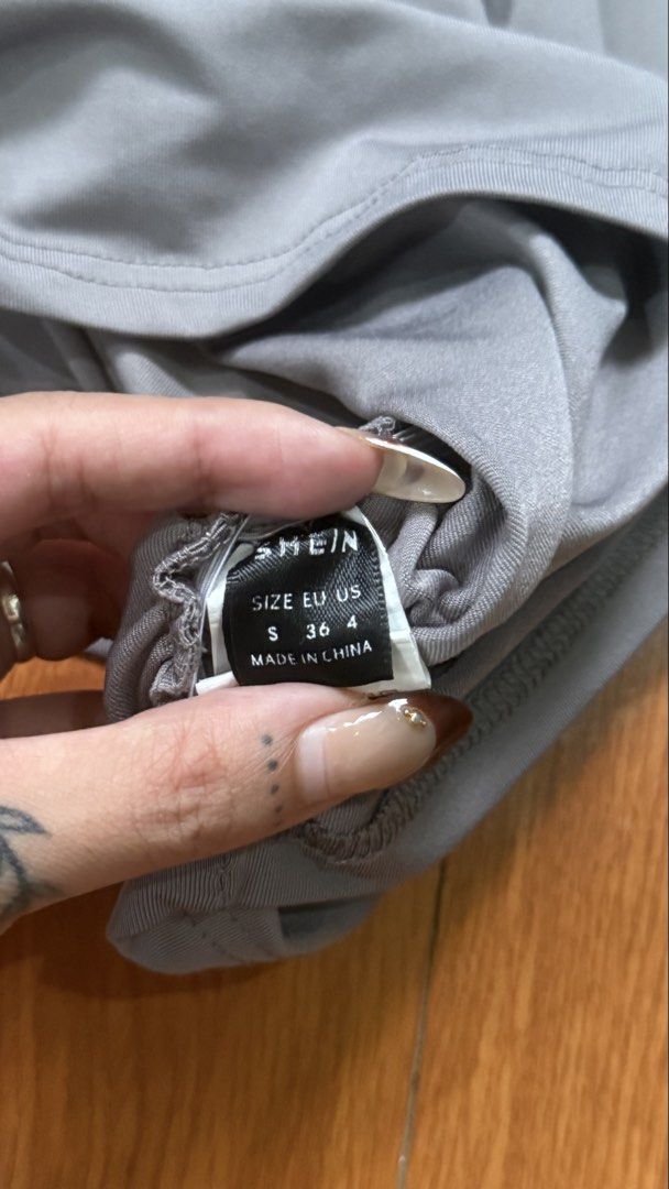 SHEIN Grey Ruched T-shirt Size S (Category: Shirts) located in Antipolo. Submitted by japanese.siomai (Listing ID 1463797525, Image 3). Description: - Brand: SHEIN - Color: Grey - Size: S - Features: Ruching detail on sides - Neckline: Crew neck - Sleeves: Short sleeves - Origin: Made in China.