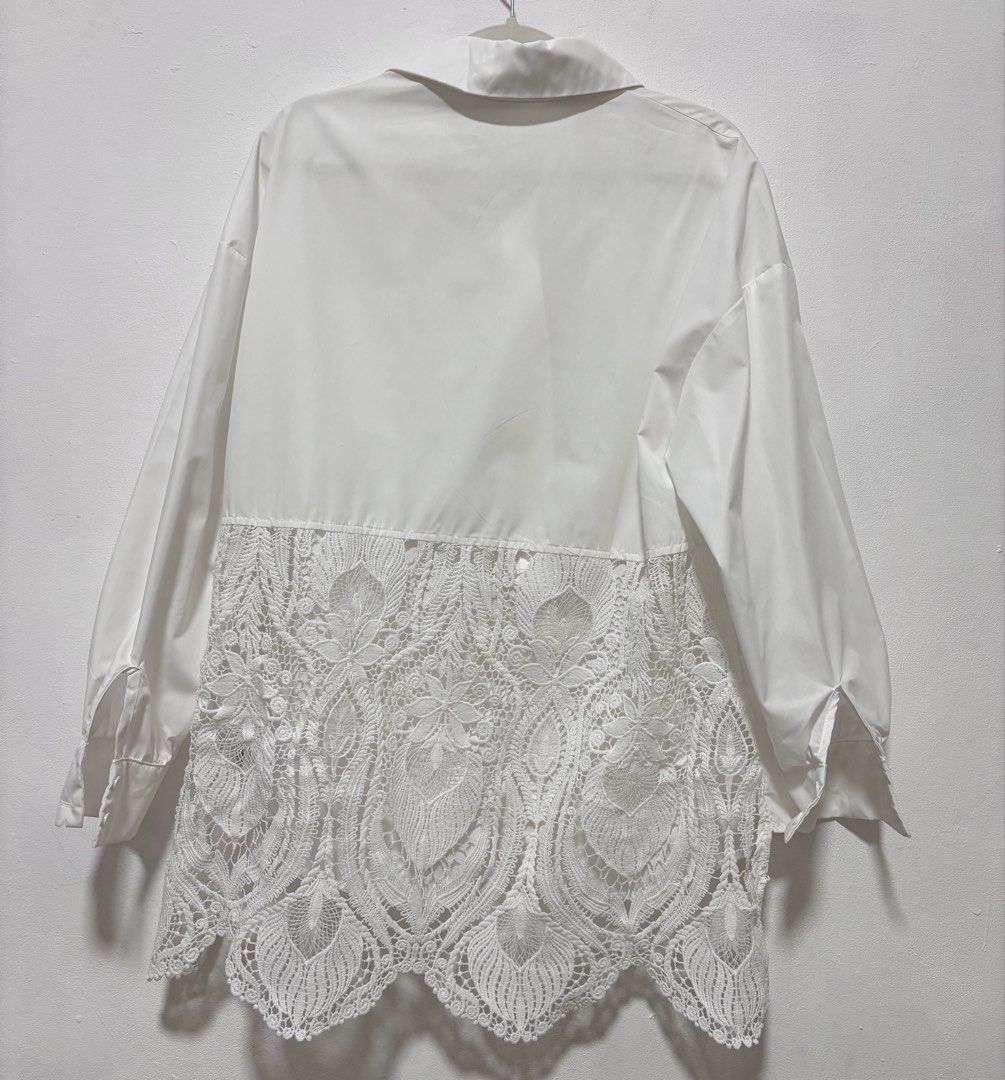 SHEIN White Oversized Lace Panel Button-Up Shirt (Category: Shirts) located in Davao. Submitted by outoftheclosetdvo (Listing ID 1463931166, Image 1). Description: - Brand: SHEIN - Color: White - Style: Button-up shirt - Fit: Oversized M-L - Details: Classic collar, button front, lace panel detail on back and sides - Versatile: Perfect for casual or dressed-up outfits.
