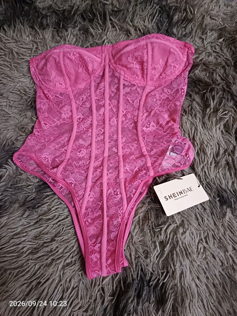 SHEINBAE Pink Lace Corset Top (Category: Sleeveless) located in Navotas City. Submitted by ladyjansen (Listing ID 1463760917, Image 2). Description: - Brand new hot pink lace corset top - Size L - Boning details for excellent shaping - Strapless design - Perfect for a night out or to add a sexy touch to any outfit - Tags still attached.