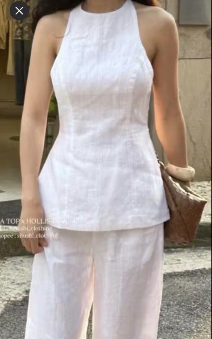 Shushi white top (Category: Sleeveless) located in Cabanatuan. Submitted by scrlttt (Listing ID 1463907541, Image 1). Description: - Chic white linen - Halter neck sleeveless top - Flattering fit - Comfortable and stylish - Ideal for casual days or beach vacations - Easy to mix and match - M-L.