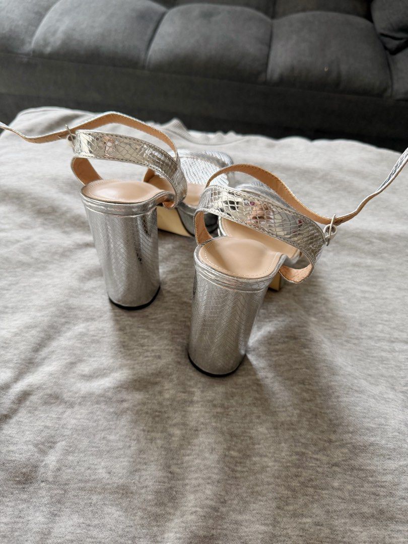 Silver Block Heel Sandals with Ankle Strap (Category: Heels) located in Manila. Submitted by closetbymia (Listing ID 1463743034, Image 2). Description: For Sale 👟✨ Size: US 7 / 24 cm Condition: never been used. Still new condition. Quality: Super nice quality & very comfy 🤍 Easy to style and can be paired with skirts, jeans, shorts, and many more! RFS: Decluttering — I have too many shoes 😅 Mode of Payment: GCash / BPI Shipping: Lalamove or J&
