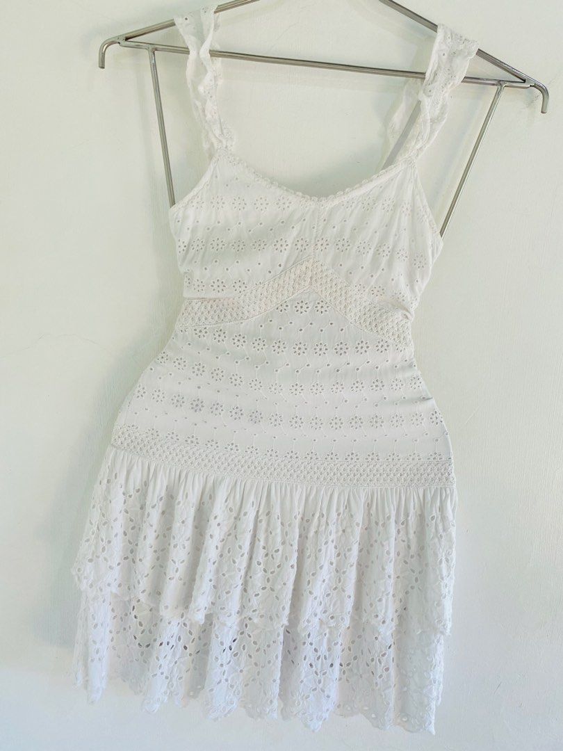 SIM & SAM White Eyelet Ruffle Strap Mini Dress XS (Category: Dresses) located in Vigan. Submitted by yourcloset1001 (Listing ID 1463901285, Image 3). Description: - White eyelet mini dress - Ruffle straps and tiered ruffled hem - Smocked back panel for a comfortable fit - Made in India - Ideal for summer days or beach trips.