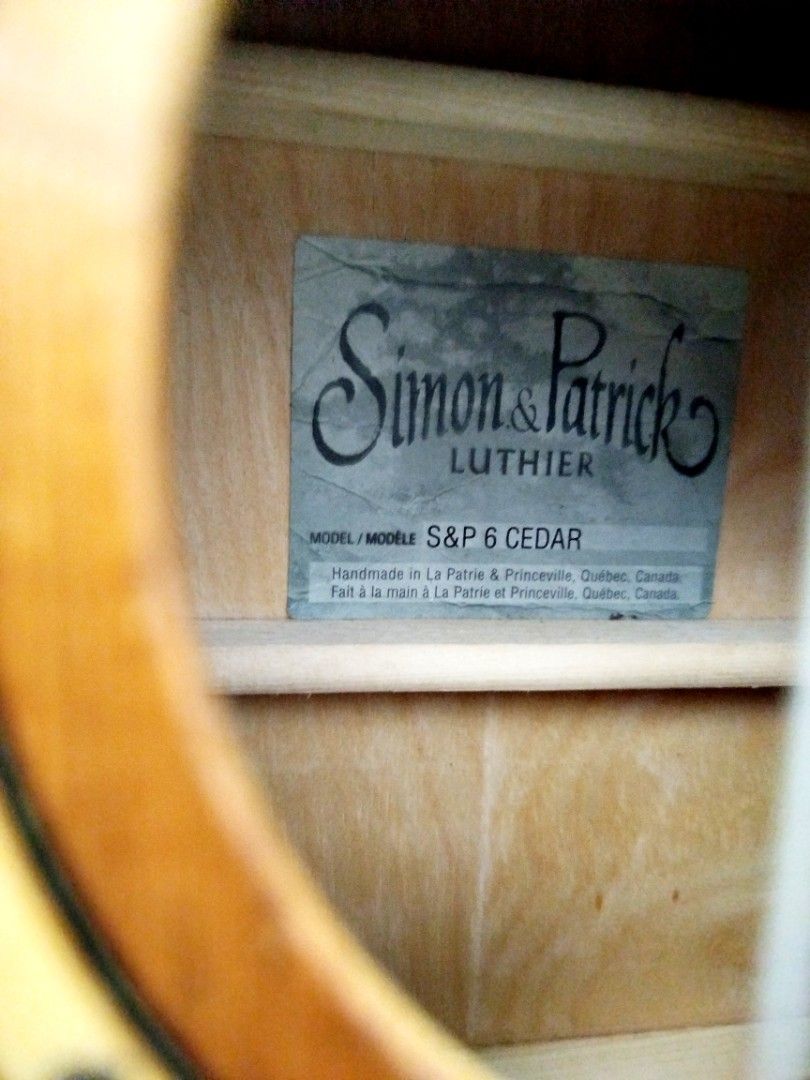 Simon & Patrick Luthier S&P 6 Cedar Acoustic Guitar (Category: Musical Instruments) located in Quezon City. Submitted by fiercefish-ad37 (Listing ID 1463830648, Image 1). Description: For Sale Simon & Patrick (crafted in Canada by Godin) known for a warm and responsive tone beautiful sounding Good condition Model: Woodland 6 Cedar or S&P 6 Cedar Body Style: Dreadnought steel-string acoustic Solid cedar top Wild Cherry Back and Sides Diecast tunin